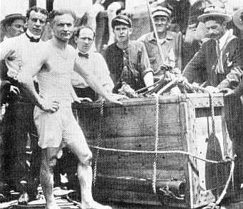 Harry houdini getting ready for buried alive trick